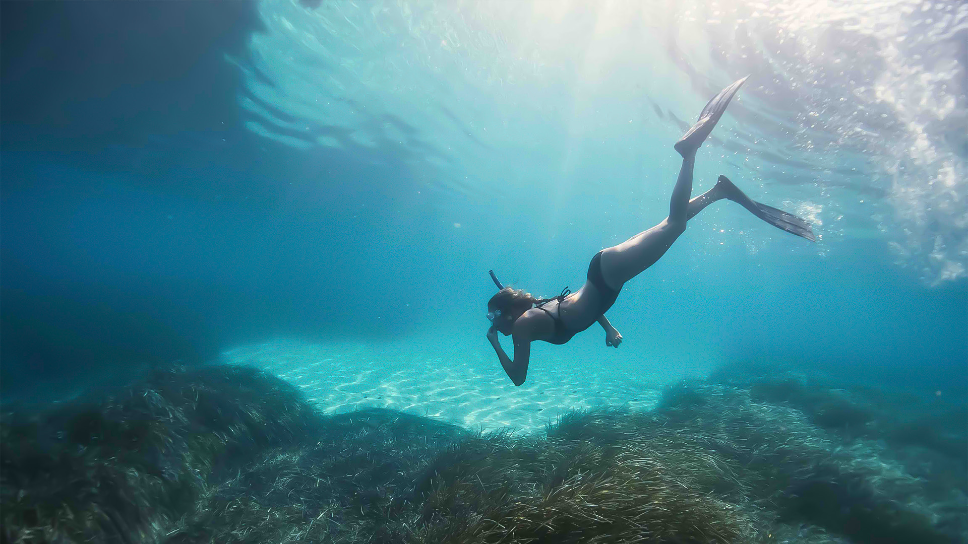 a woman in a garment underwater