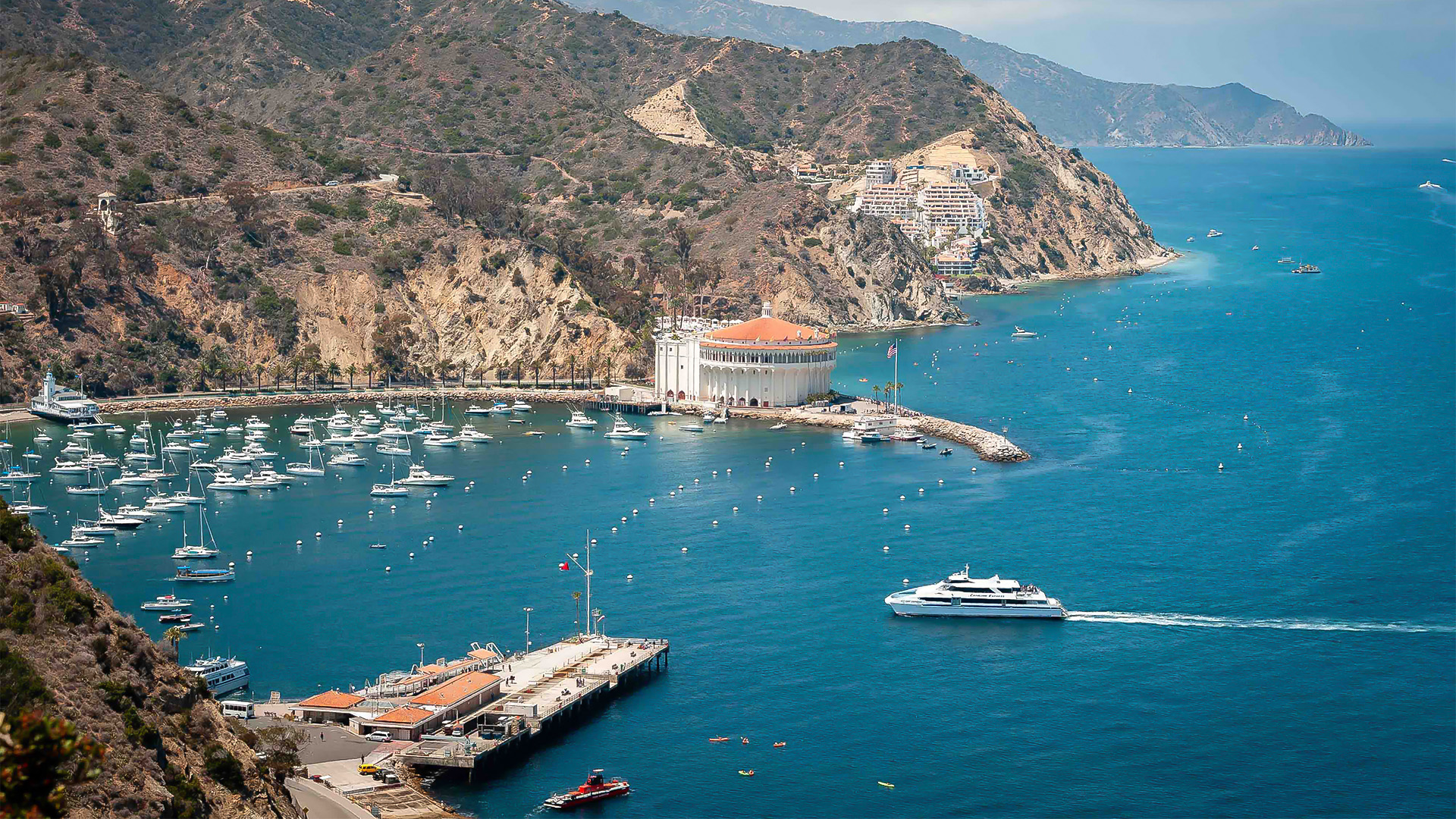 a large building with many boats in the water