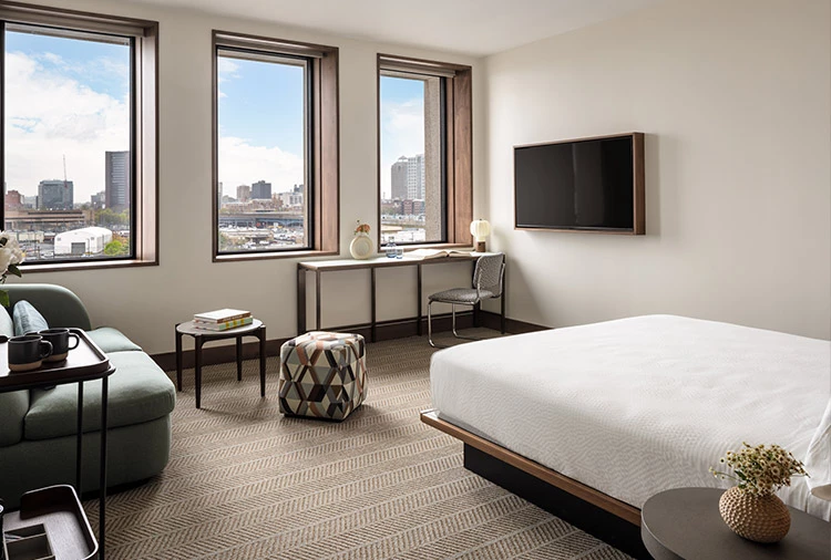 a bedroom with a large window