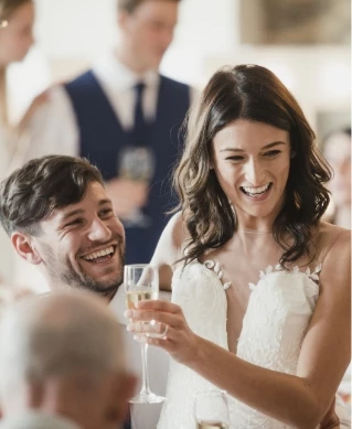 a man and woman holding a glass of champagne