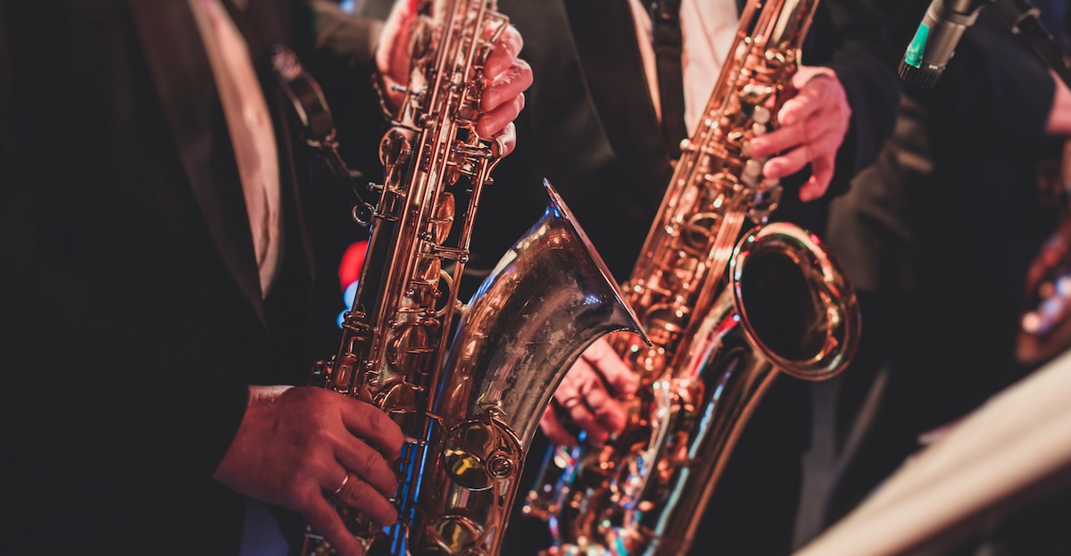 a person holding a saxophone