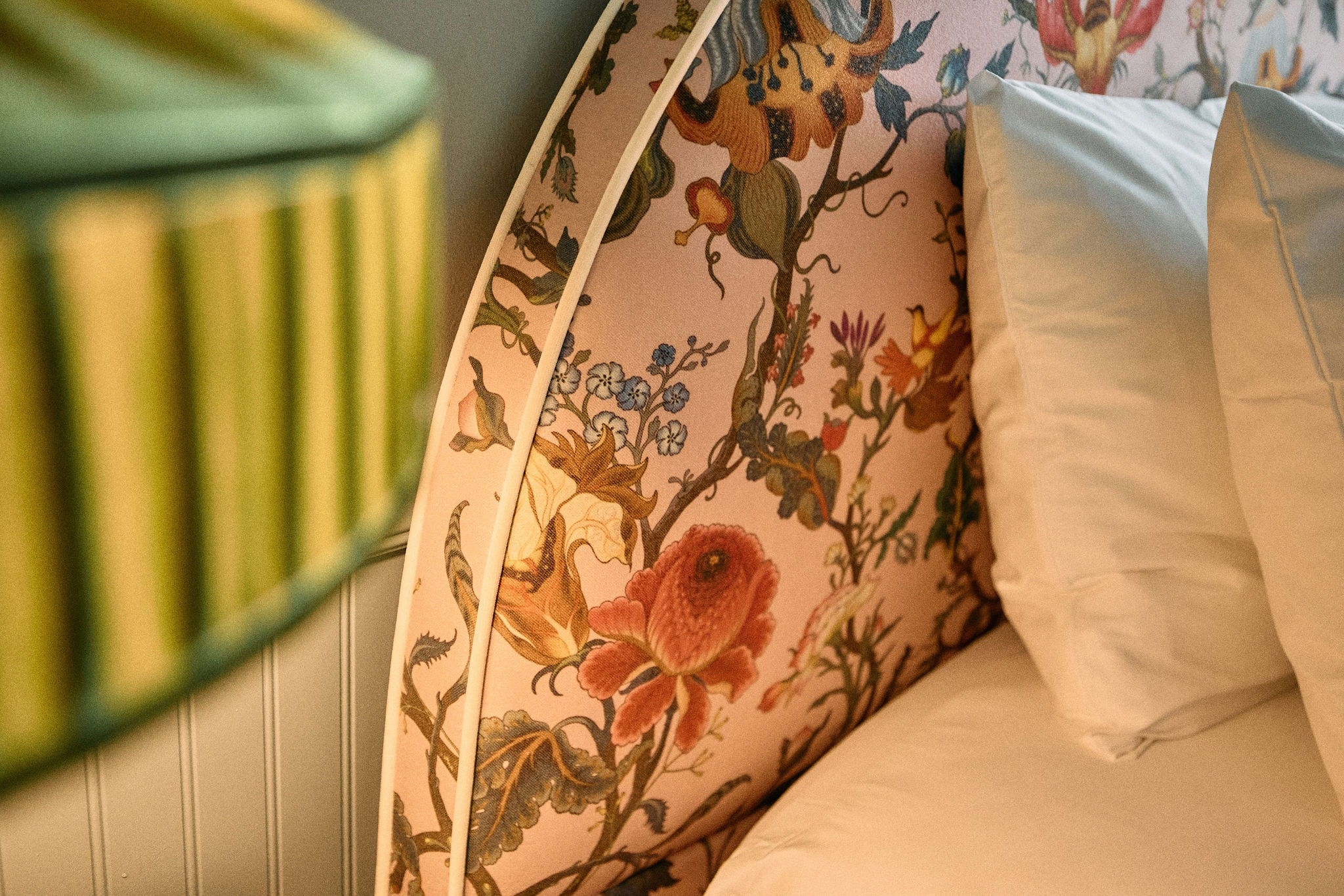 a bed with floral fabric