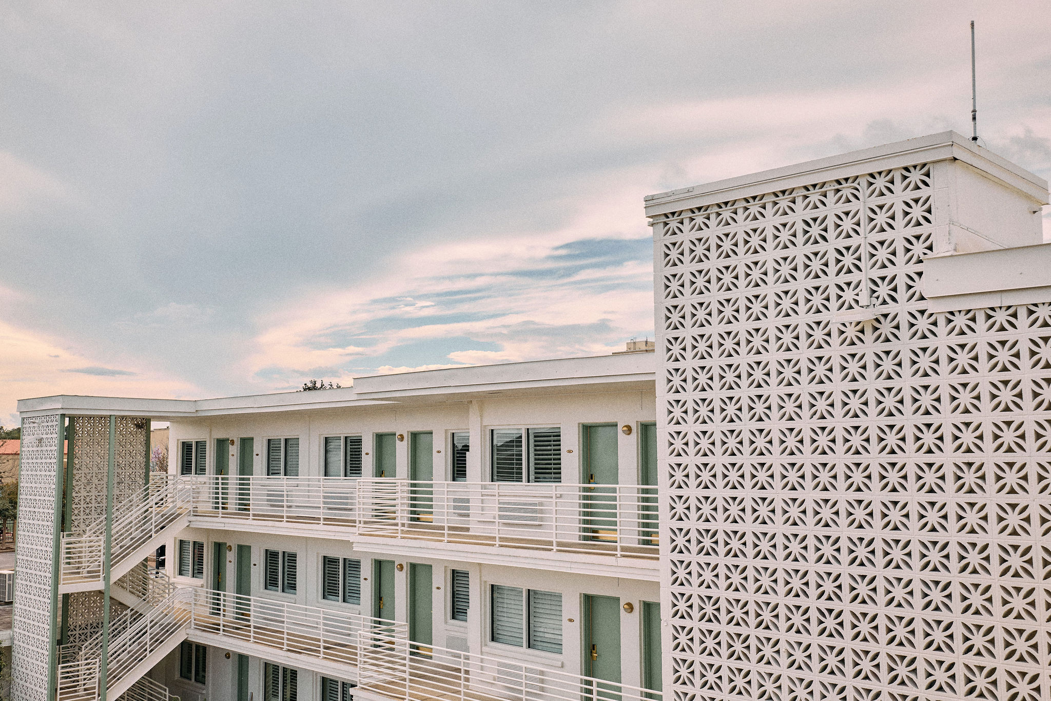 a building with balconies and stairs