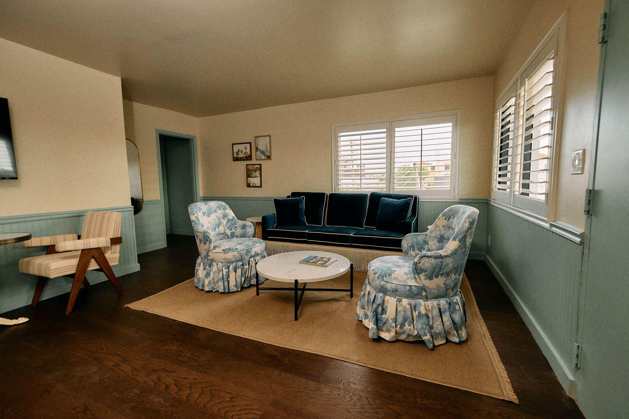 a living room with a couch and chairs