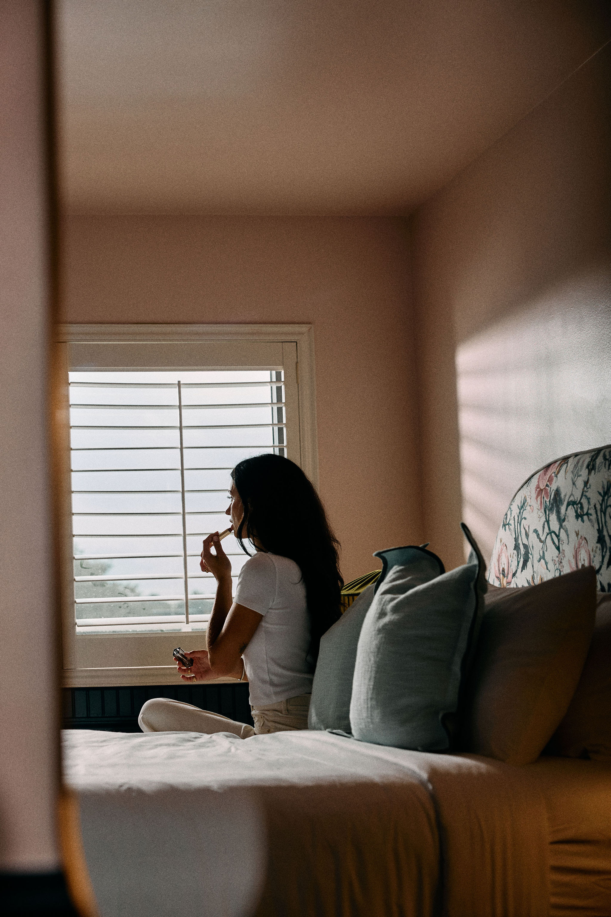 a woman sitting on a bed