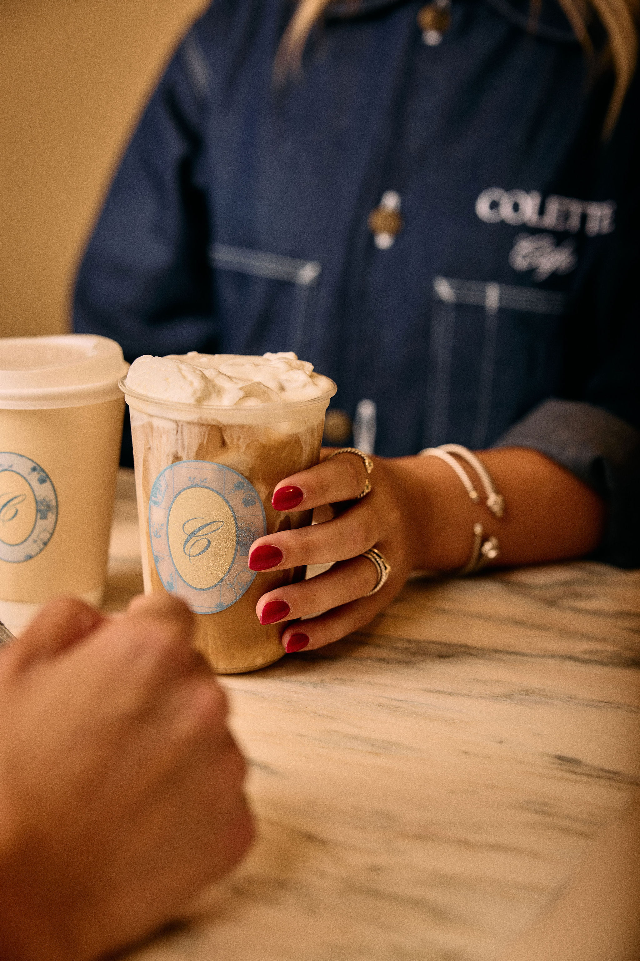 a person holding a cup of coffee