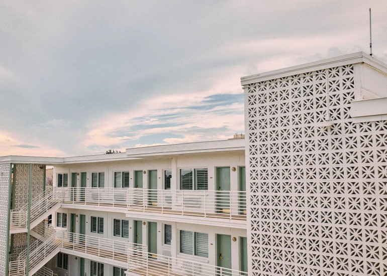 a building with balconies and stairs