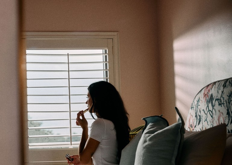 a woman sitting on a bed