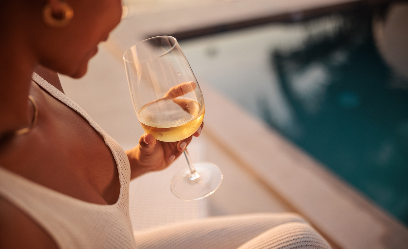a woman holding a glass of wine