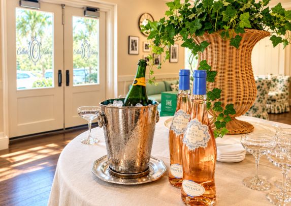 bottles of wine in a bucket on a table