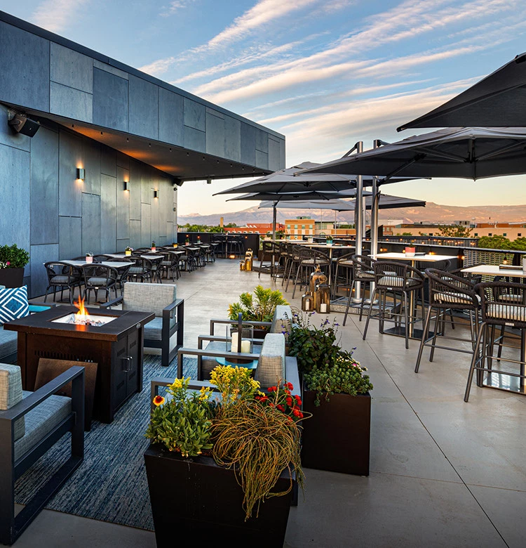 a patio with tables and chairs