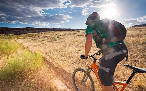 person mountain biking