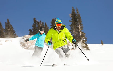 two people skiing