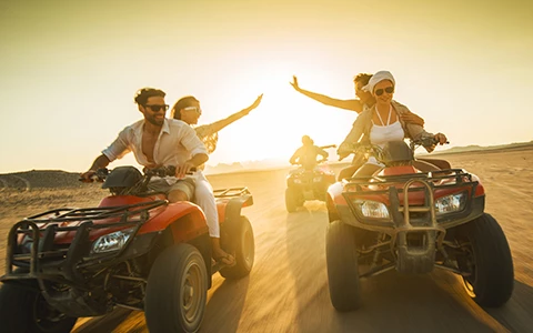 group of people riding ATVs