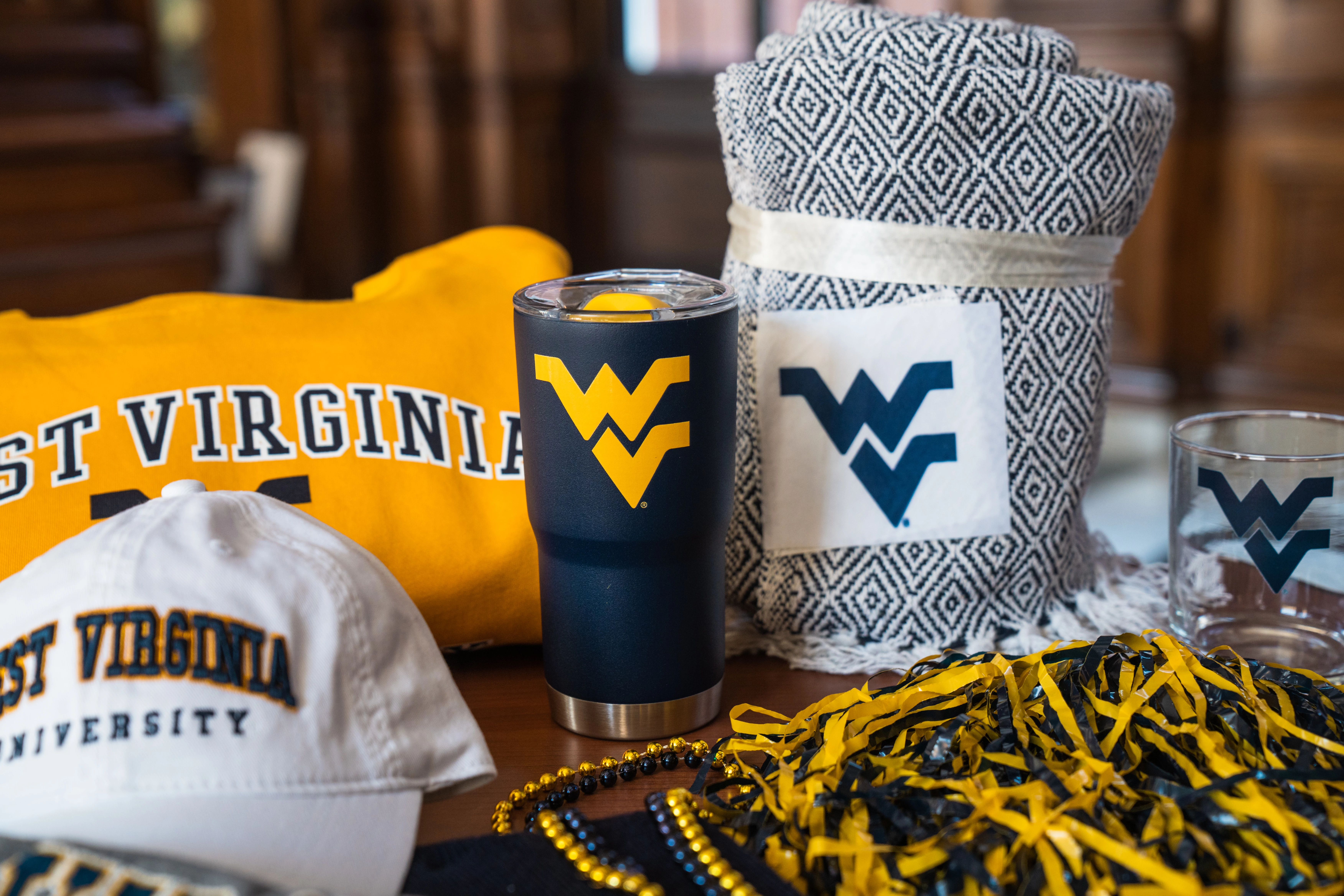 a blanket and a tumbler on a table