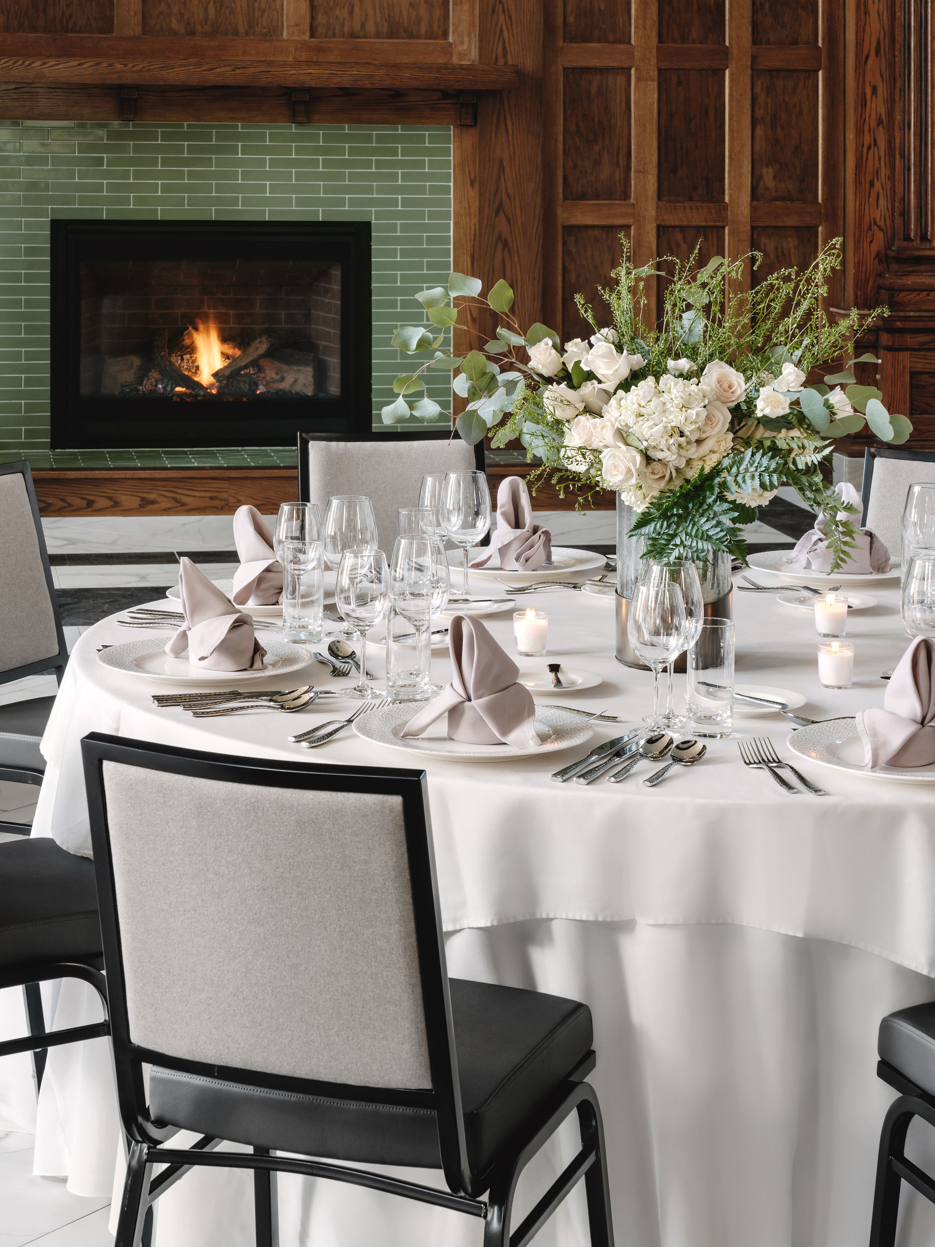 table set up with plates, flowers and utensils