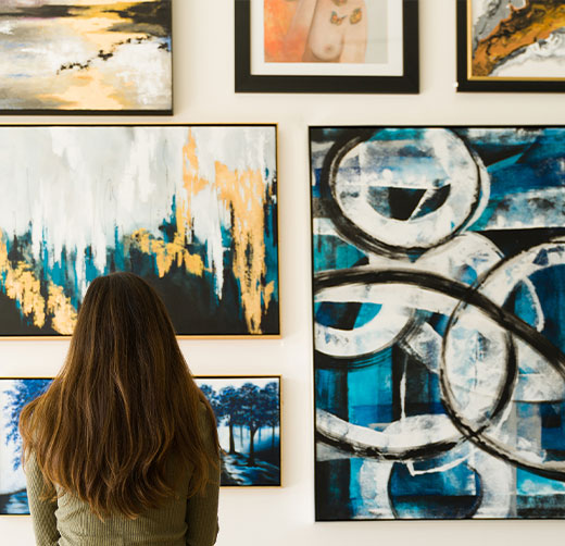 woman looking at an art exhibition