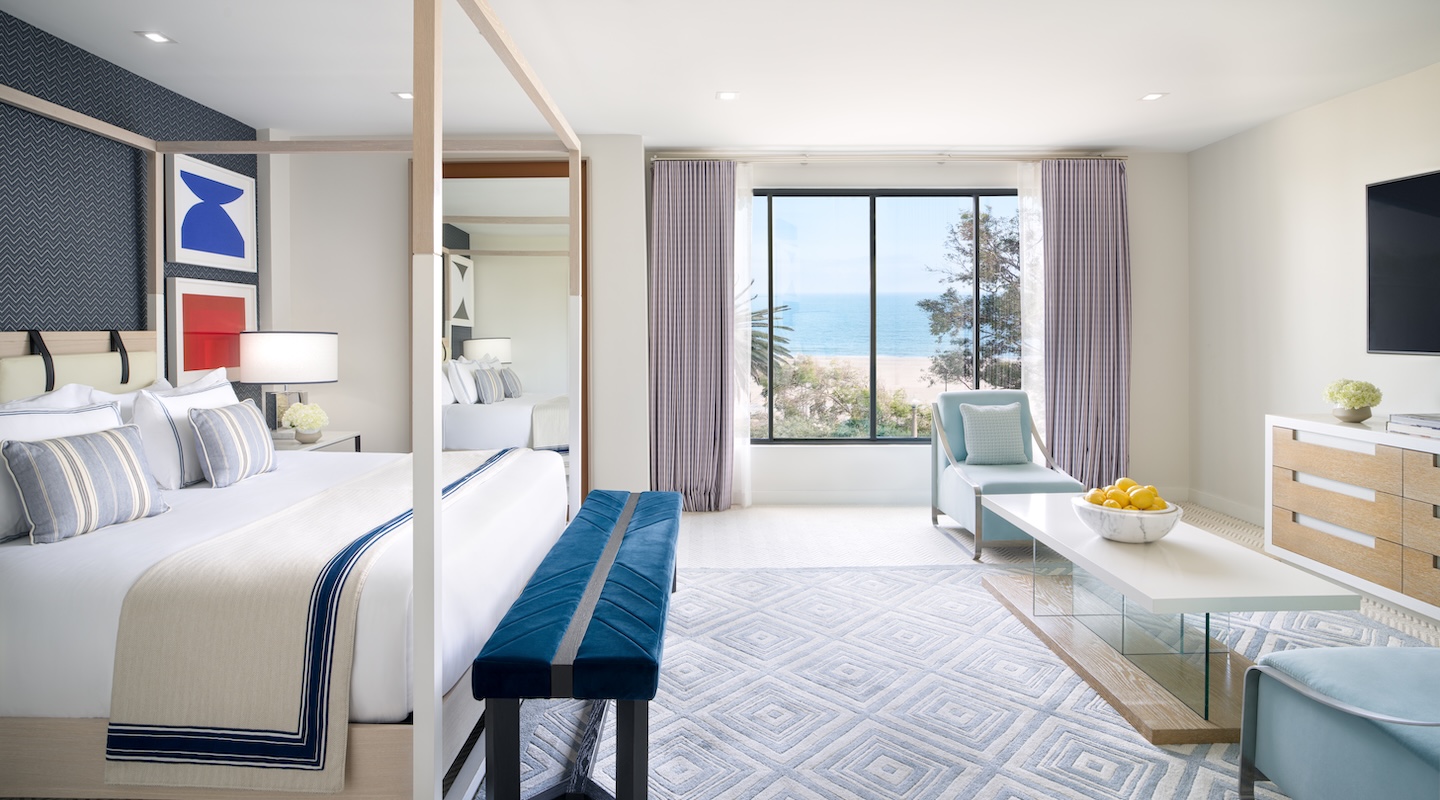 a room with a bed and a bench