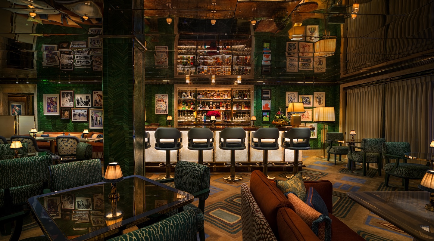 a bar with chairs and a table