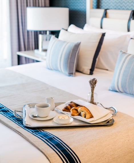 a tray of breakfast on a bed