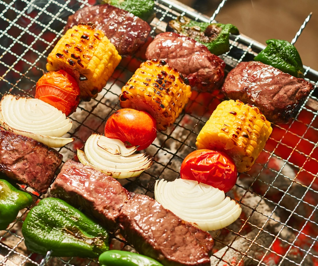 meat and vegetables on a grill