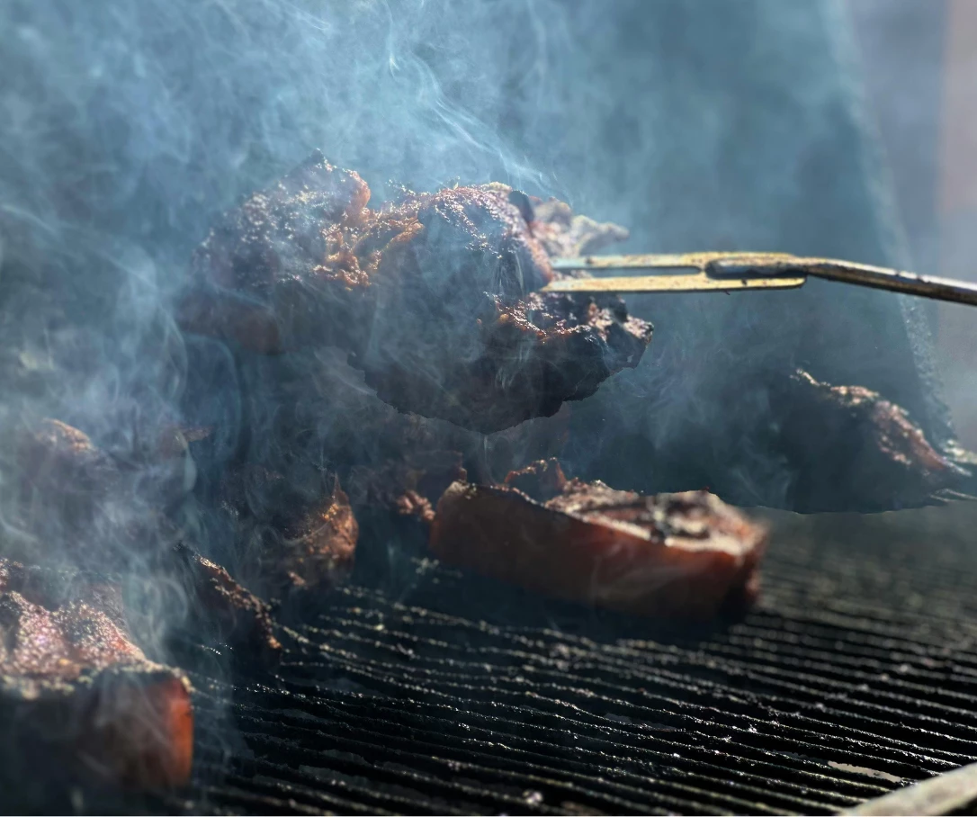 meat being cooked on a grill