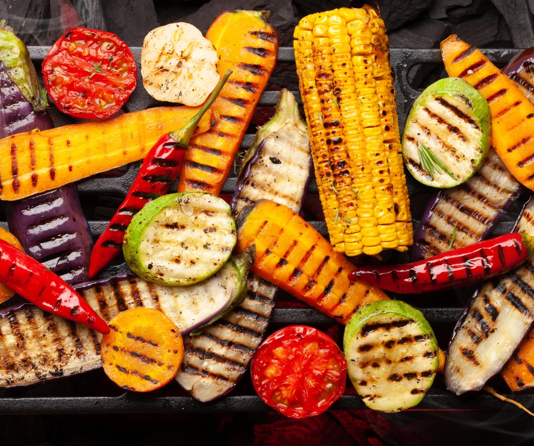 a grill with vegetables on it