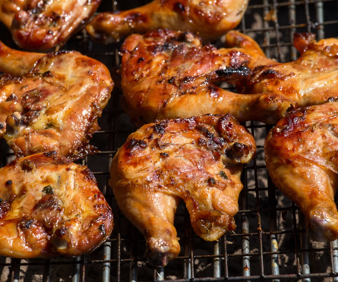 chicken legs on a grill