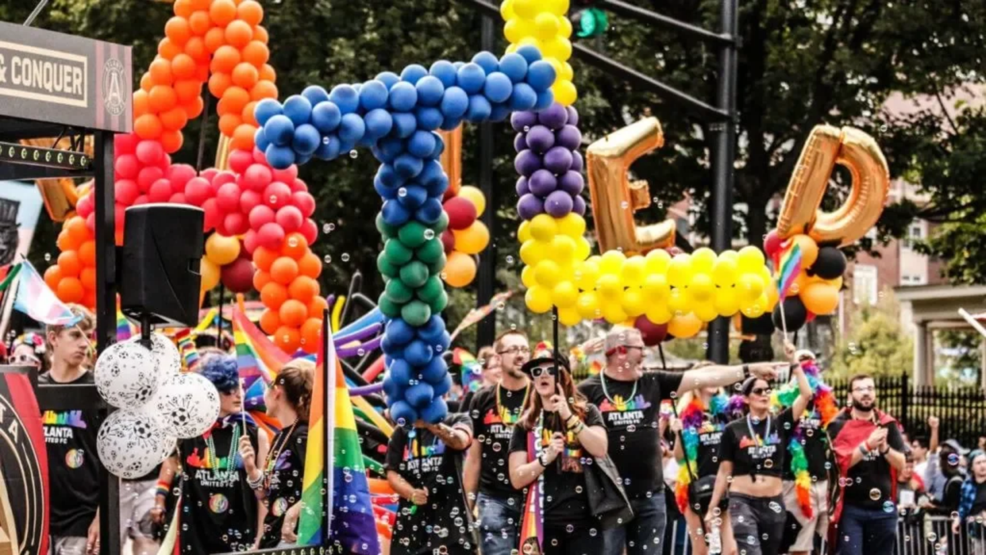 a group of people holding balloons