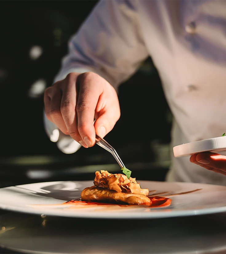 a person holding a plate of food