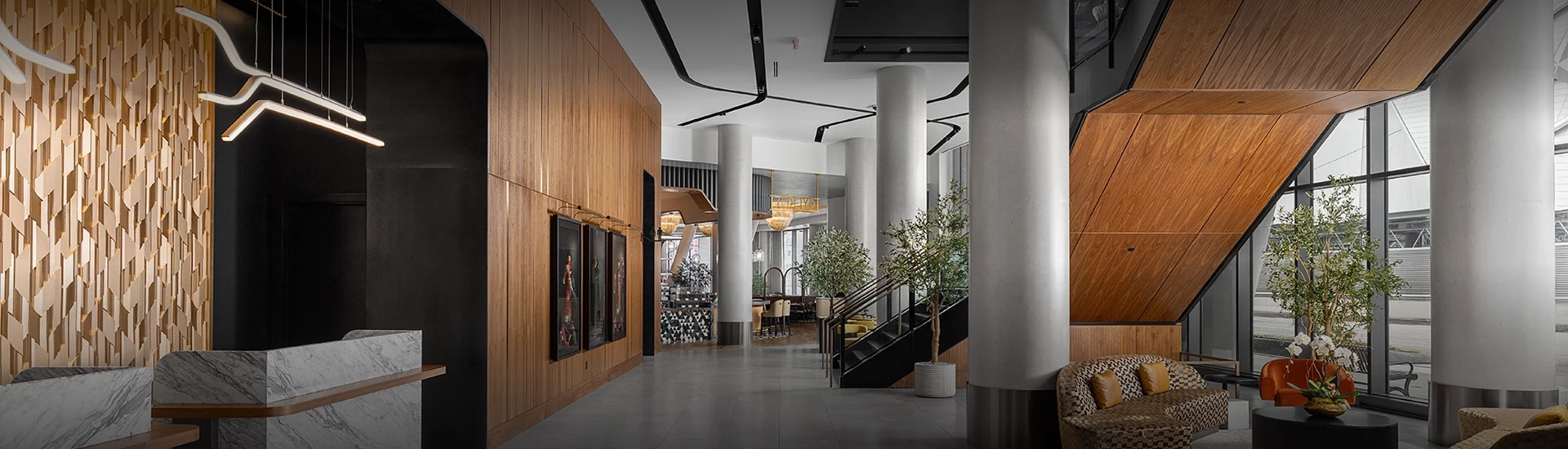 a large building with a staircase and art on the wall