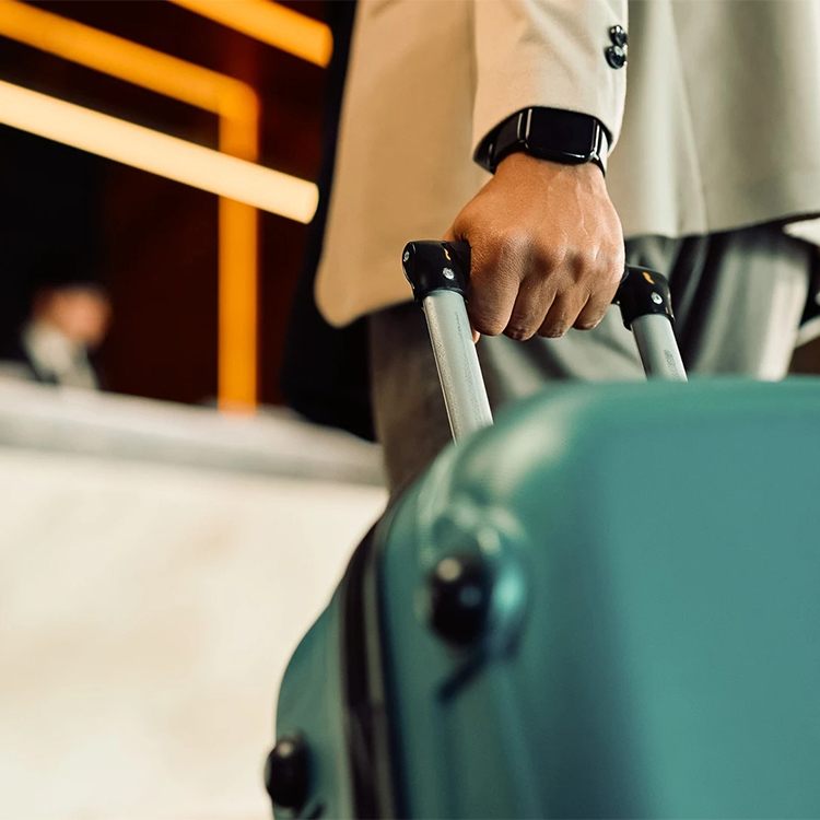 a person holding a suitcase