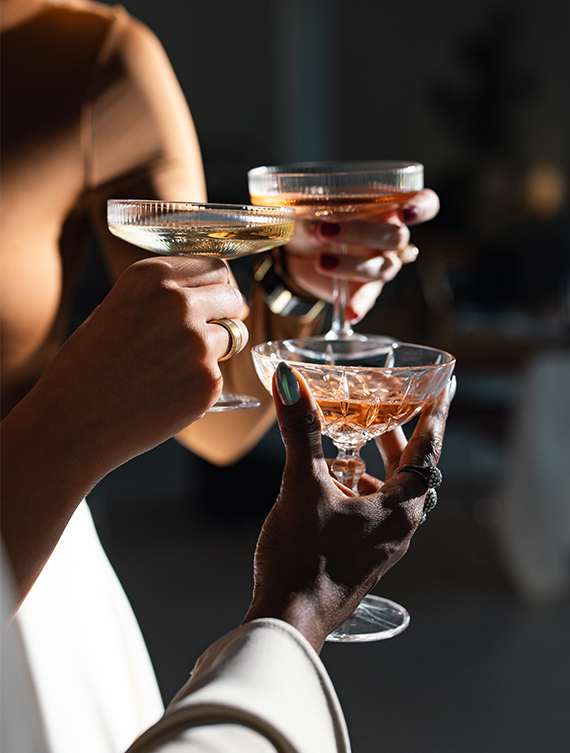 a group of people holding glasses