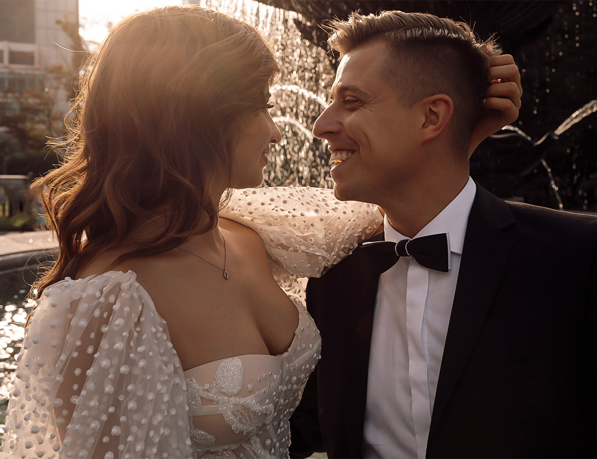 a man and woman smiling at each other