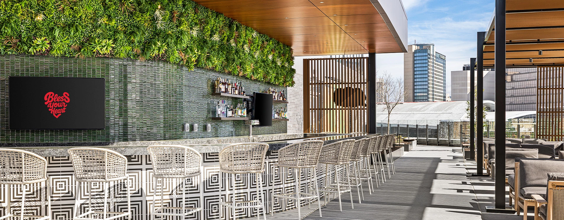 a bar with chairs and a bar counter