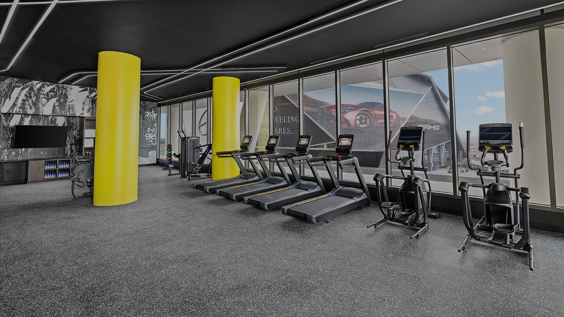 a gym with treadmills and exercise equipment