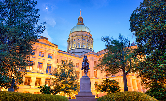 a statue of a horse in front of a building