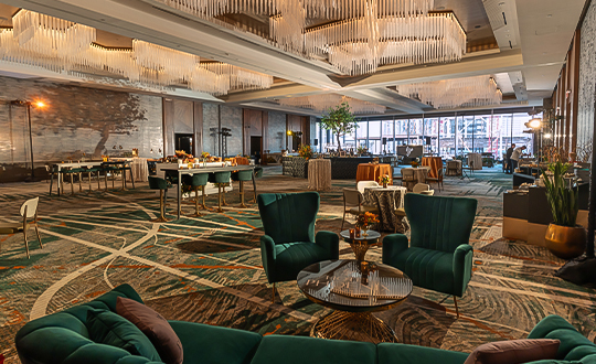 a room with green chairs and tables