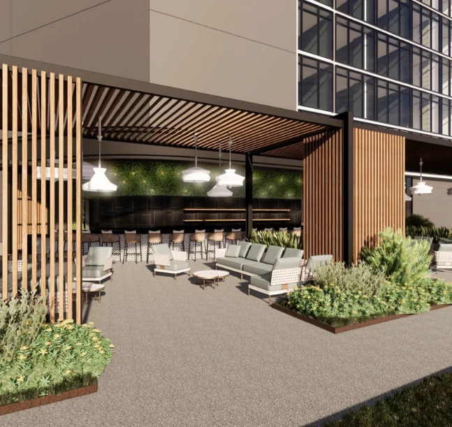 a building with a patio and chairs