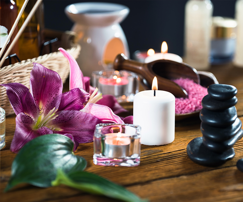 a close up of candles and flowers