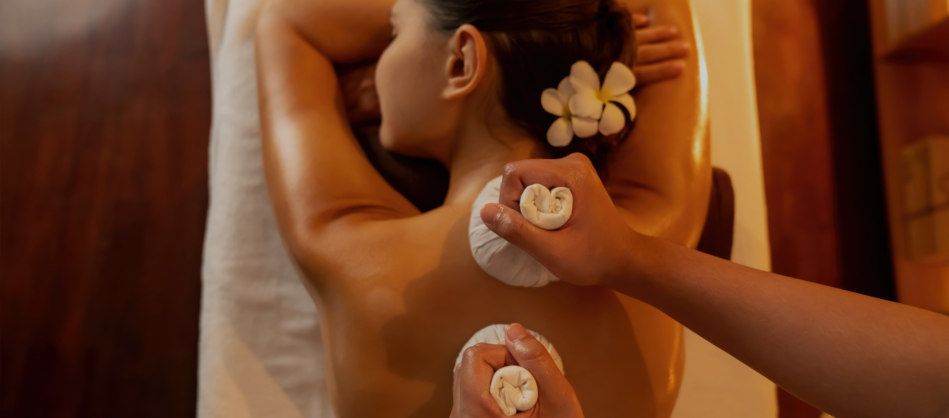 a woman lying down on a massage table