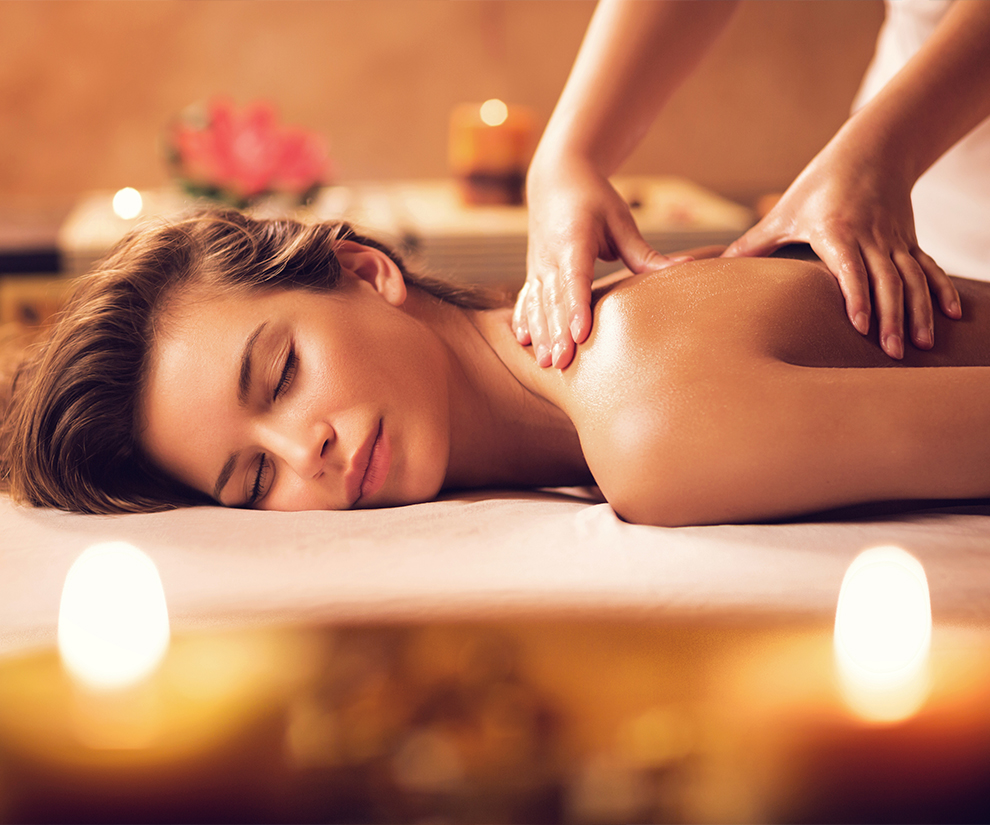 a woman lying down on a massage table