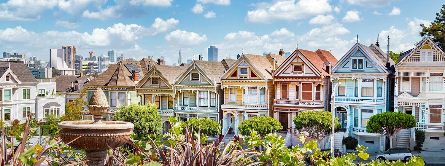 Panoramic view of a colorful downtown and a water source with a clear sky at daytime