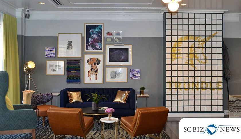 a room with a couch and chairs