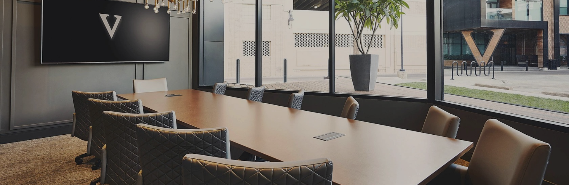 a table with chairs in front of a window
