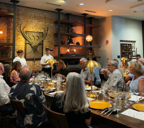 a group of people sitting at a table