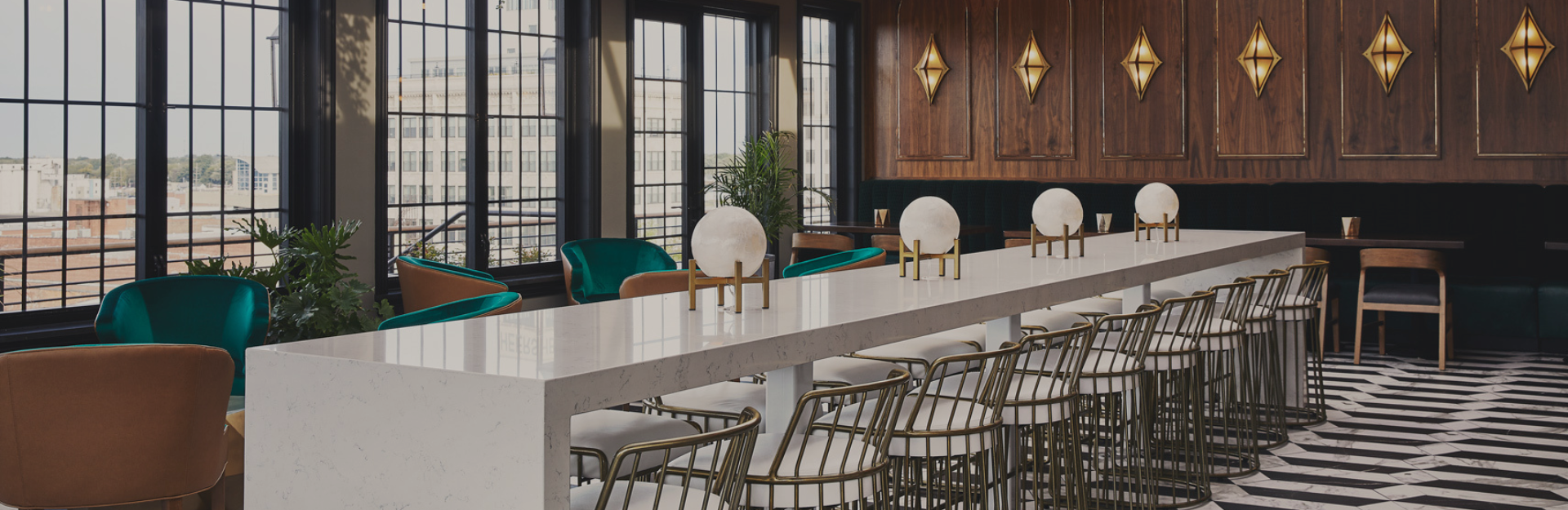 a room with a long table and chairs