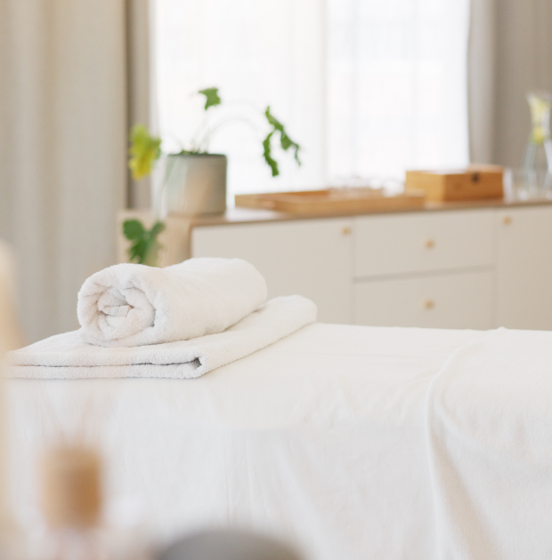 a white towel on a bed