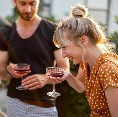 a group of people holding wine glasses