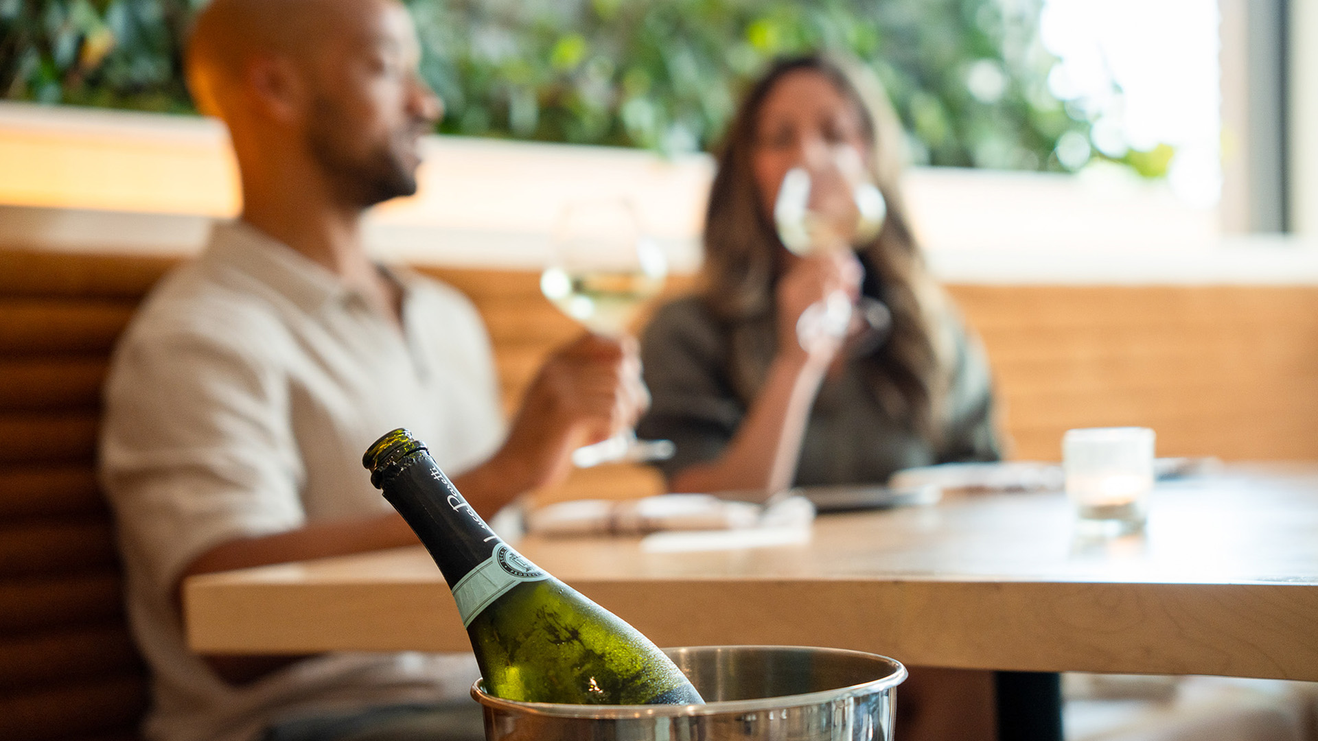a bottle of wine in a bucket